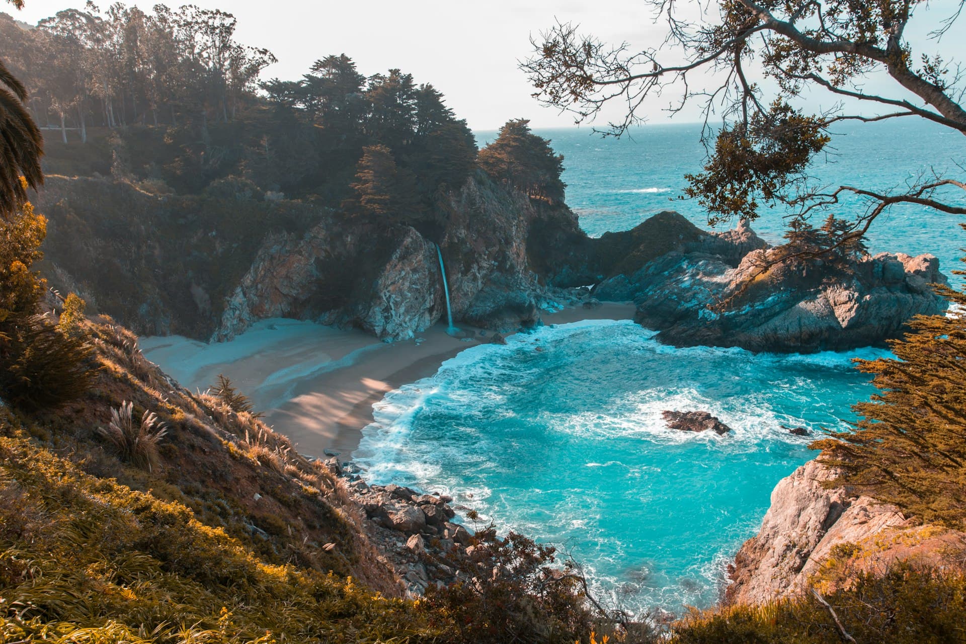 Crystal-clear teal water at a California coastal cove — the colors that inspired CoCoLo